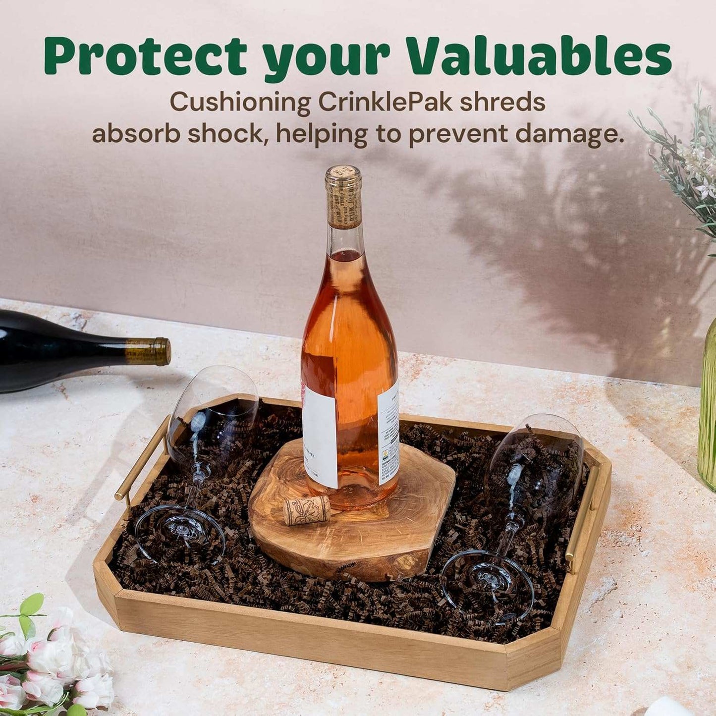 Chocolate Crinkle Cut Shred cushioning brown shredded paper used as protective packaging filler with a wine bottle and glasses on a wooden tray