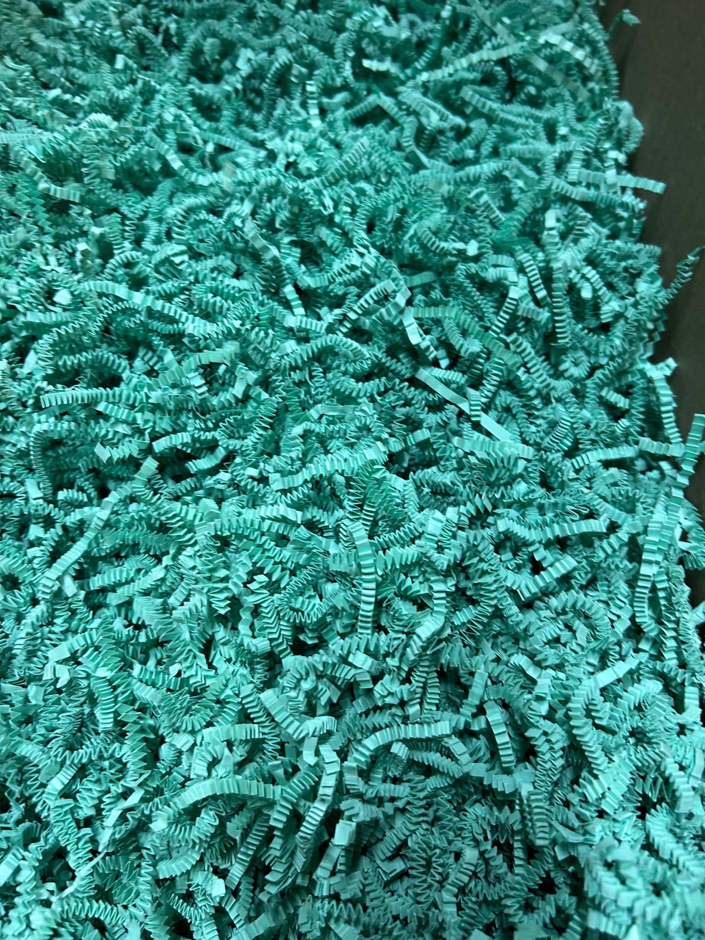 Light green crinkle cut shred for packaging and protection.