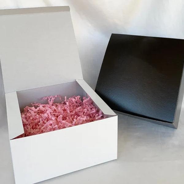 Colorful shredded paper in a gift basket illustrating how to pick the best shredded paper for gift basket packing
