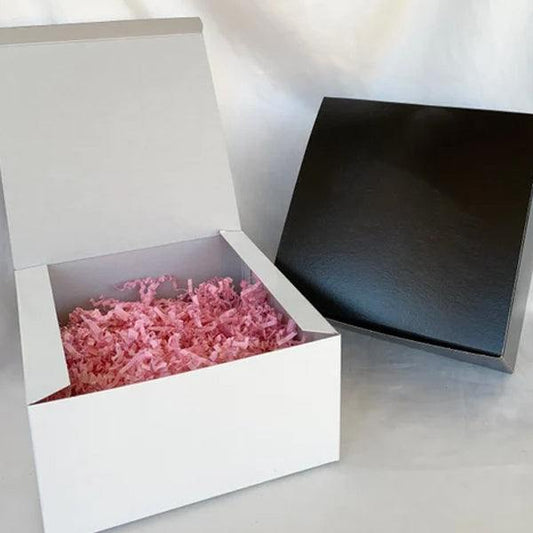 Colorful shredded paper in a gift basket illustrating how to pick the best shredded paper for gift basket packing
