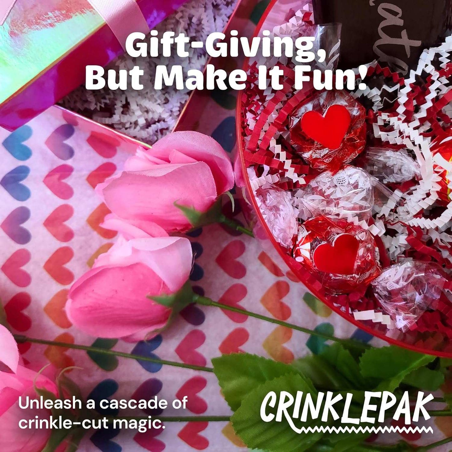 Red and white candy cane crinkle cut paper filler in festive gift packaging with pink roses and chocolates