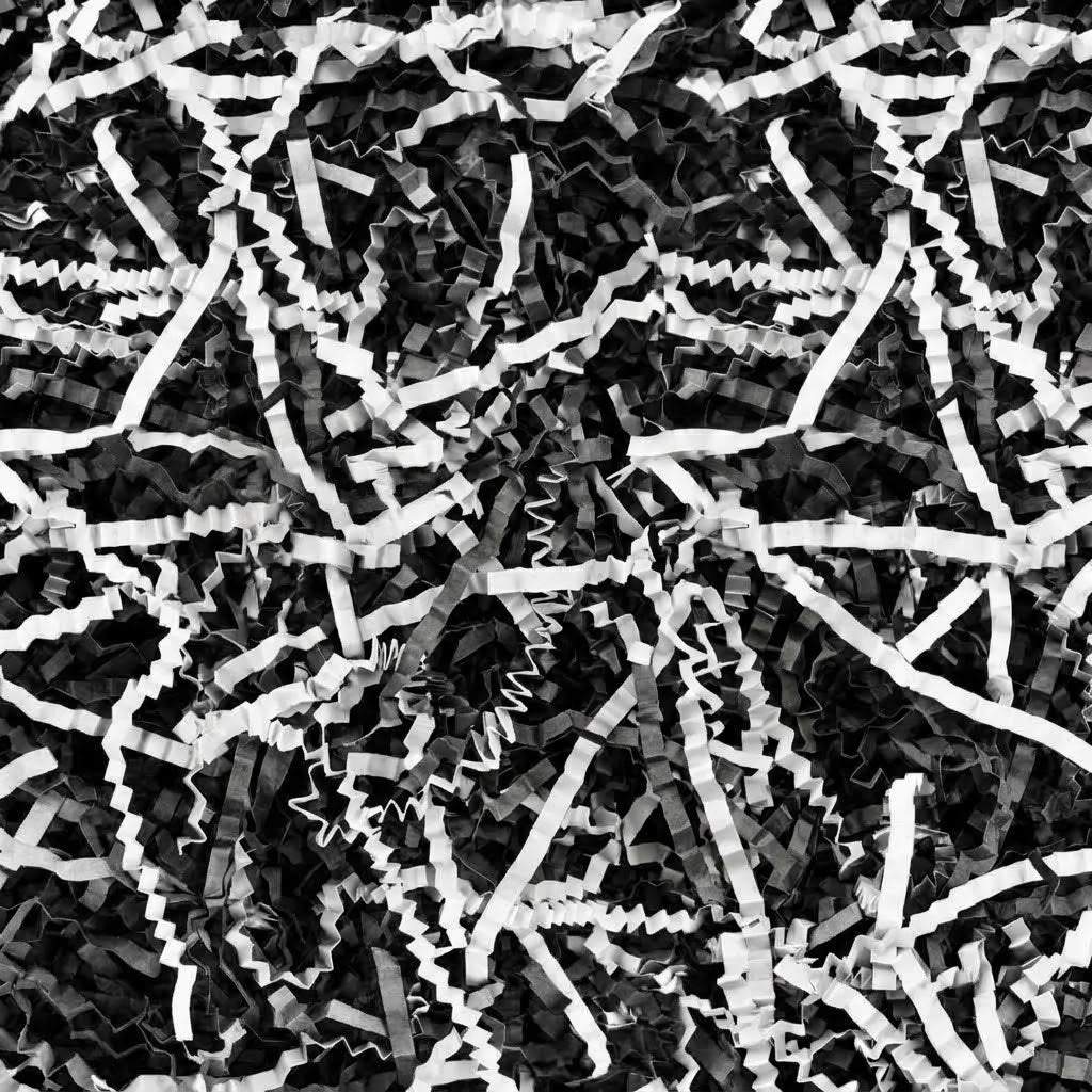 2 LBS black and white crinkle paper filler with shredded strips and zigzag texture