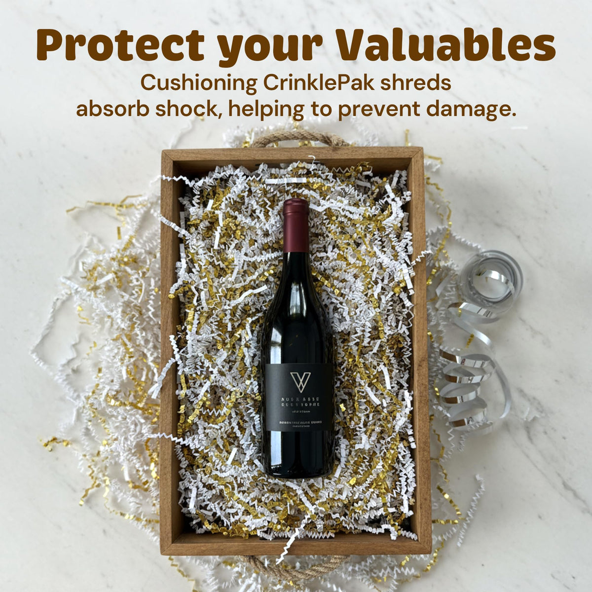 Crinkle paper filler in white and gold, protecting a wine bottle in a box; 40 lb White and Gold packaging shreds.